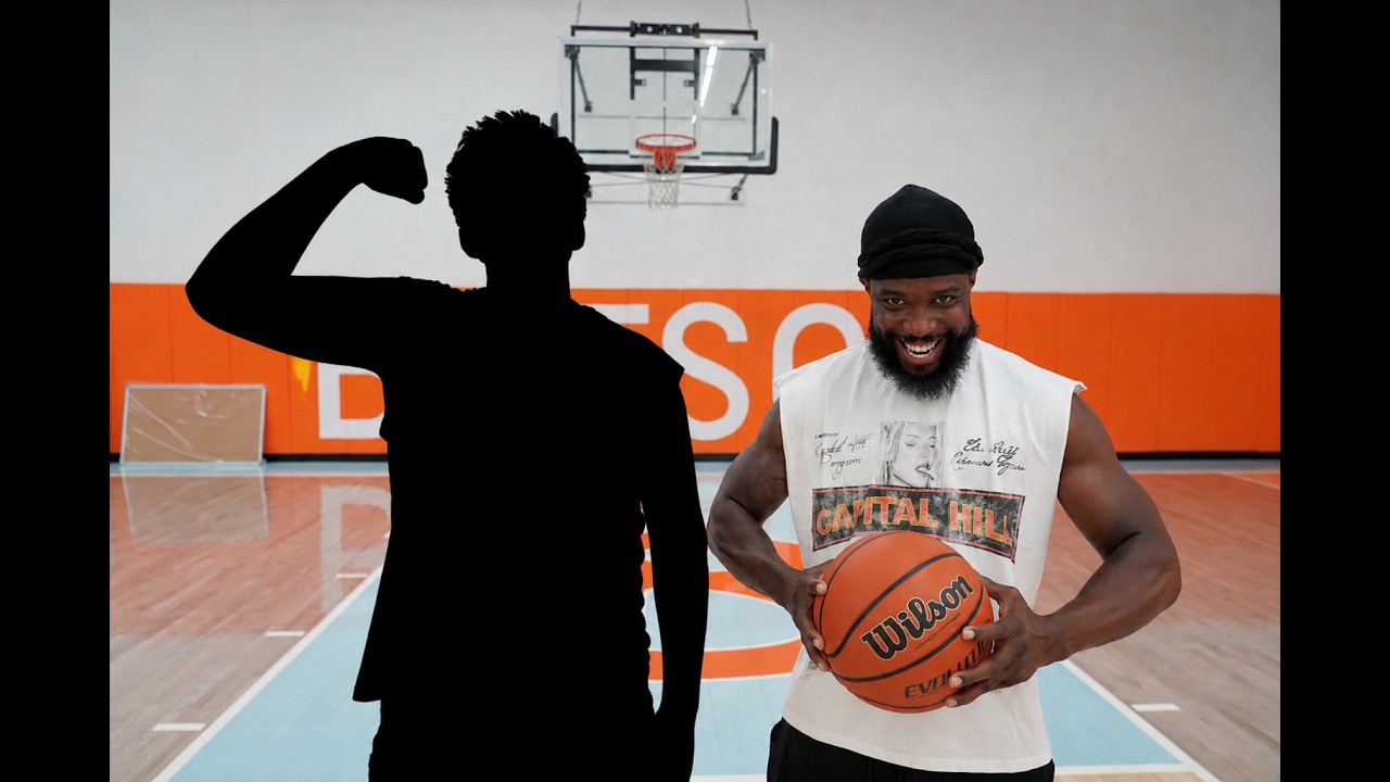 CashNasty on court holding a basketball